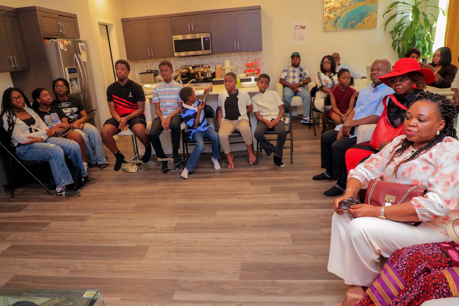Community members of several generations seated together during a Women Beyond Borders Canada session