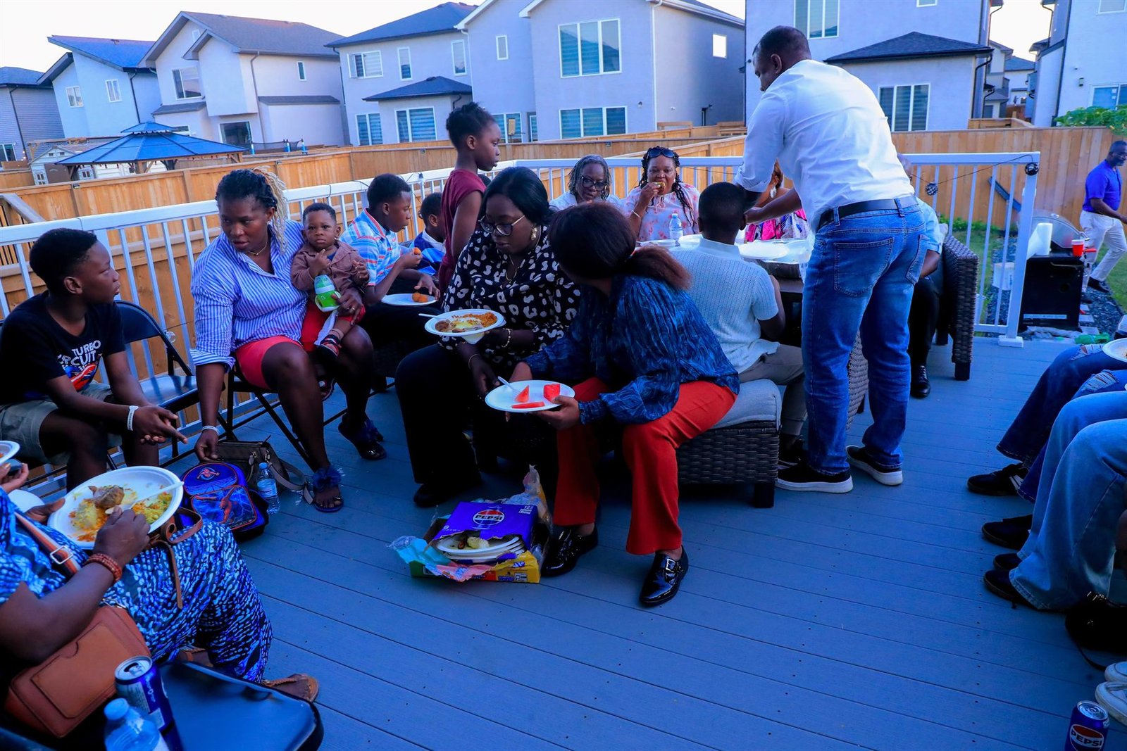 Families gathered together at a Women Beyond Borders Canada community event