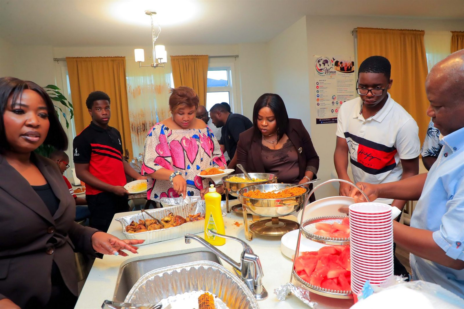 People of several generations sharing a meal at a Women Beyond Borders Canada gathering